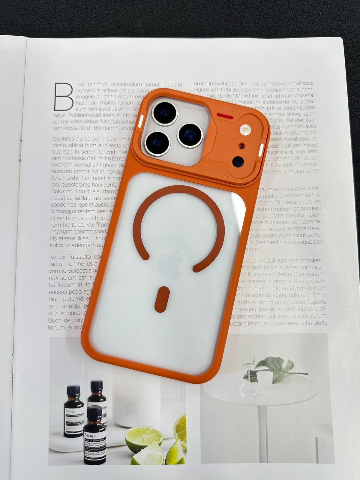 iPhone 17 Pro clear case with orange frame, MagSafe ring and raised camera guard